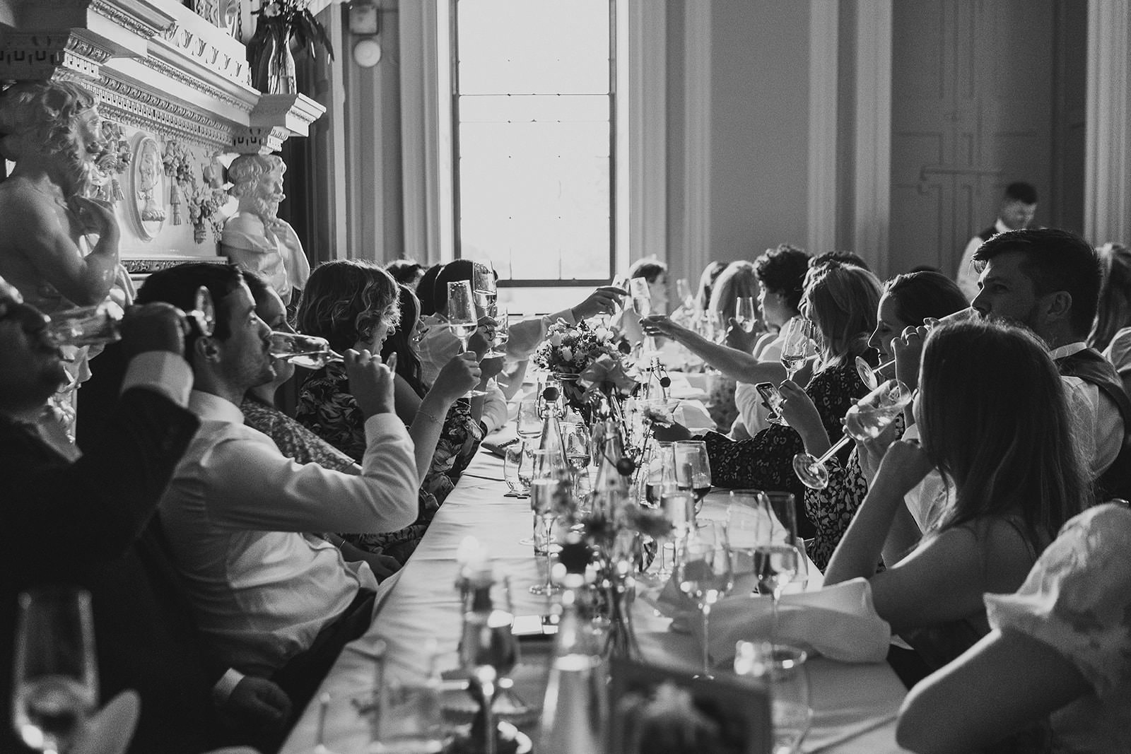 guests enjoying drinks at wedding breakfast in natural light at Shropshire wedding venue, Davenport House