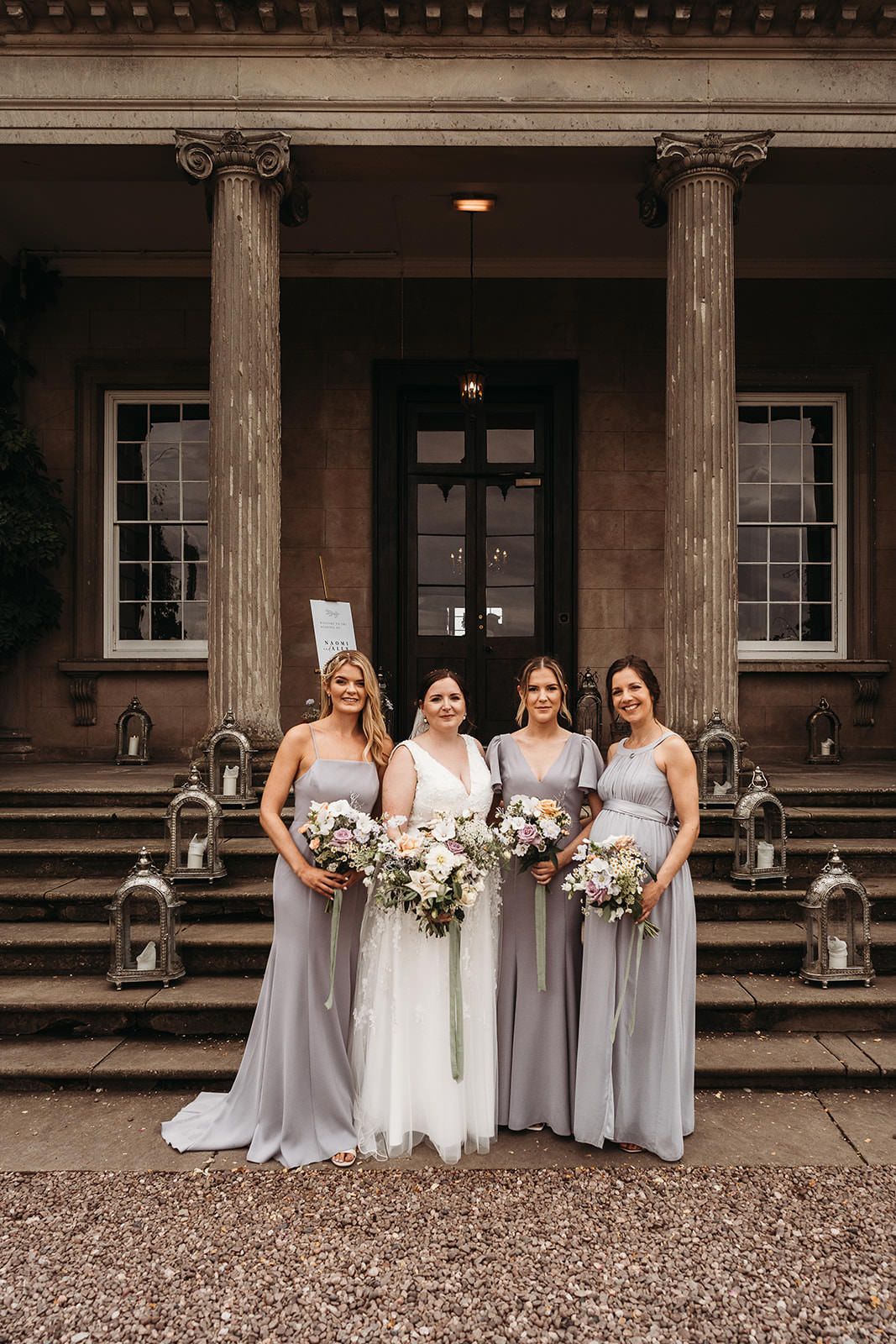 Bridesmaid in purple dresses outide shropshire wedding venue, Davenport House