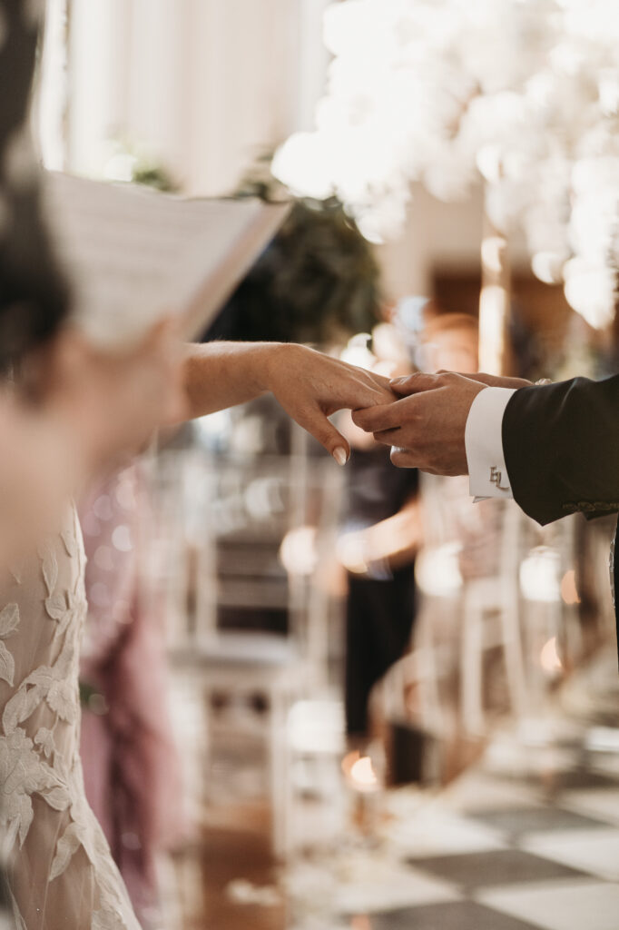 exchanging wedding rings during wedding ceremony at Shropshire Venue, Hawkstone Hall  