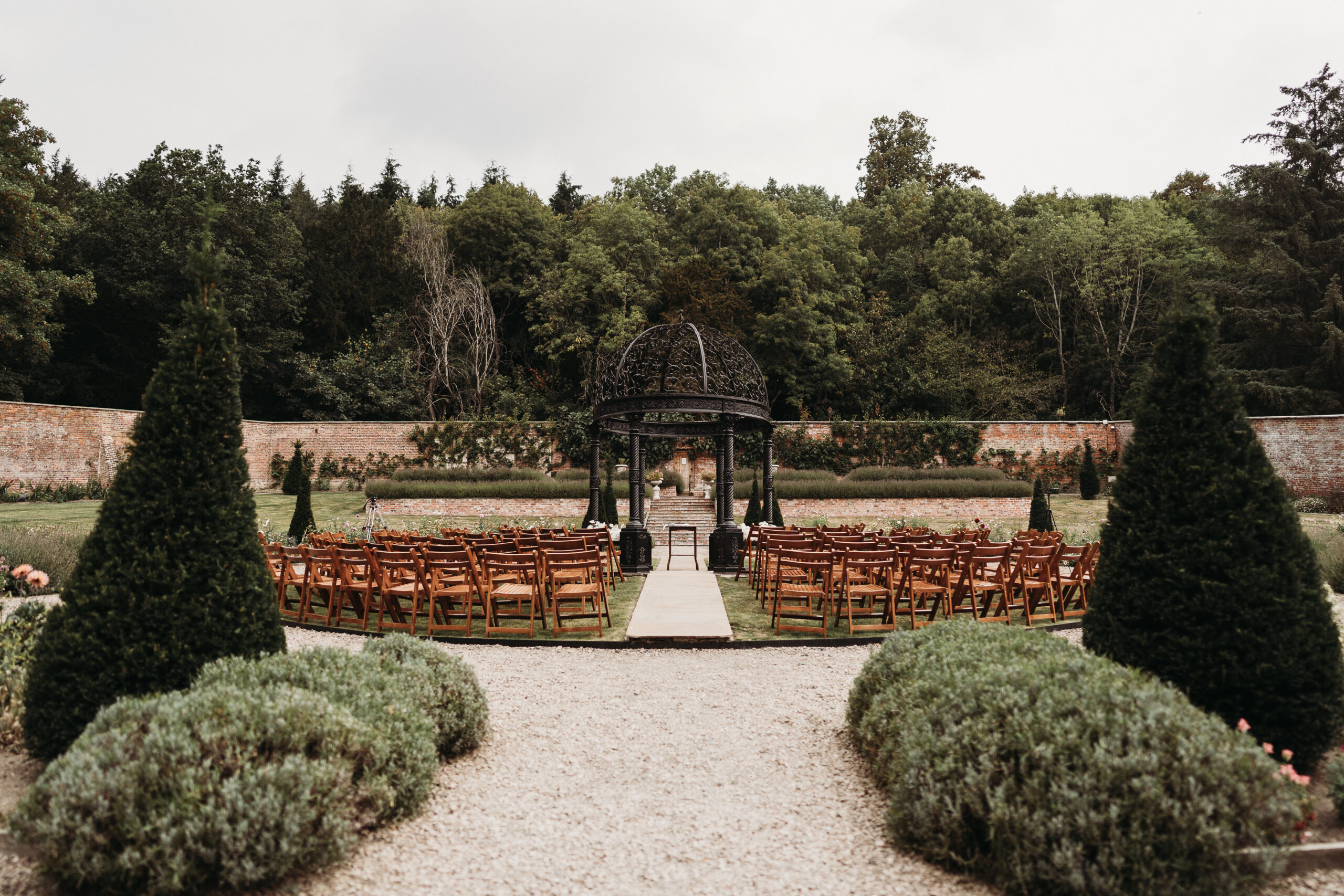 walled garden ceremony set up at Shropshire wedding venue, Garthmyl Hall 