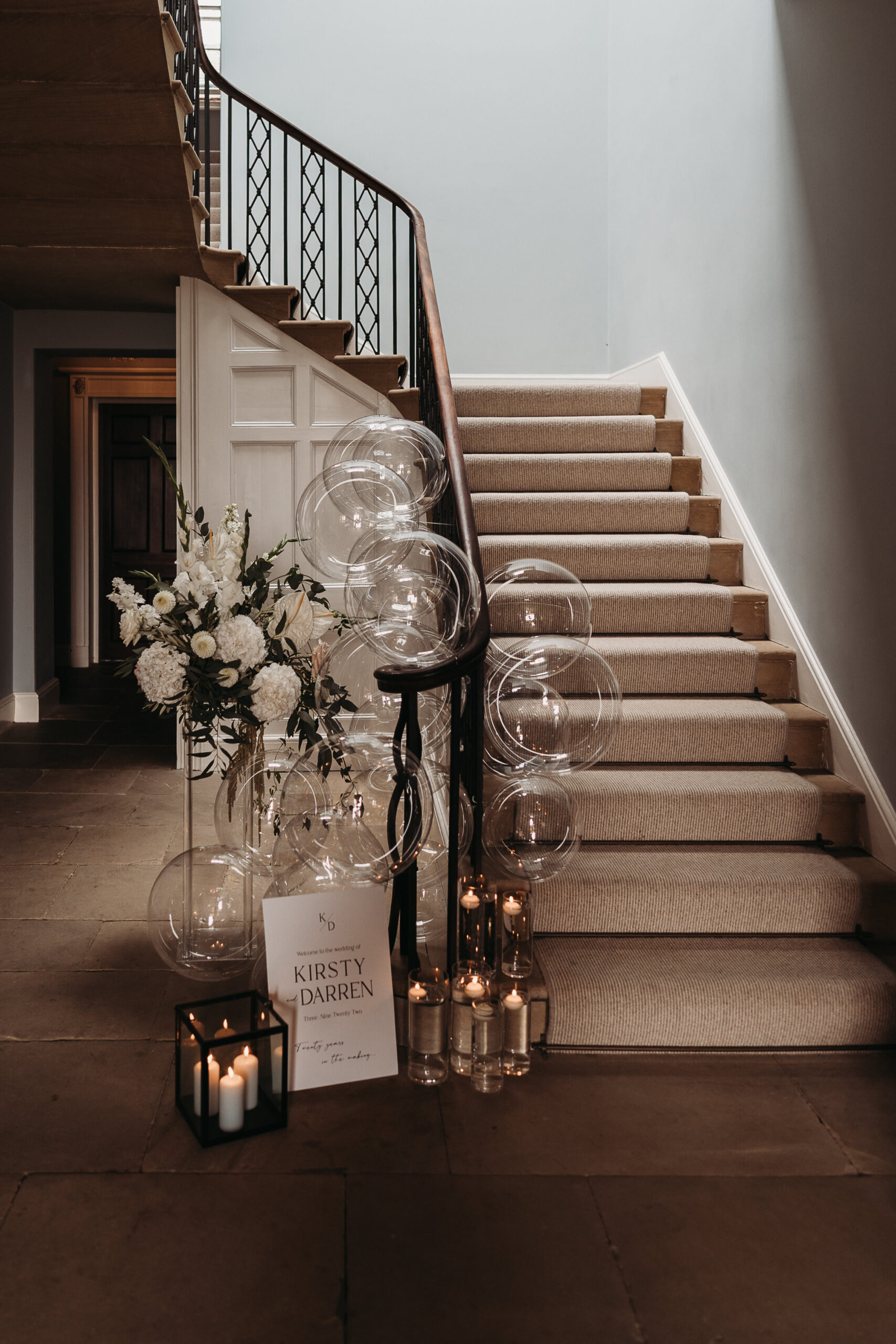 inside entrance Shropshire Wedding venue, Garthmyl Hall. styled with clear balloons and candles  