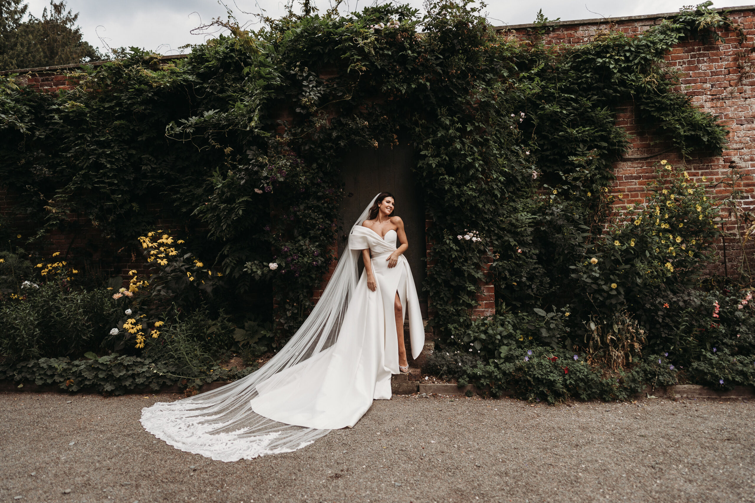 bride portrait outside in the gardens of Shropshire Wedding venue, Garthmyl Hall. 