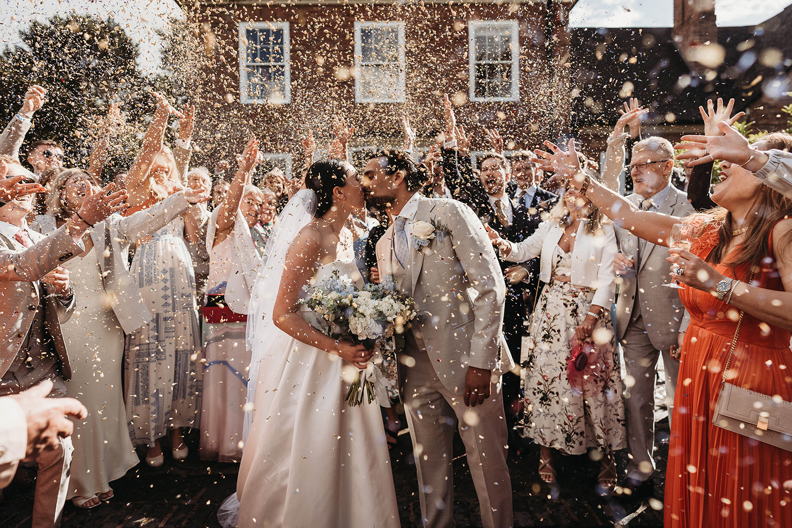 Couple kissing with confetti enveloping them