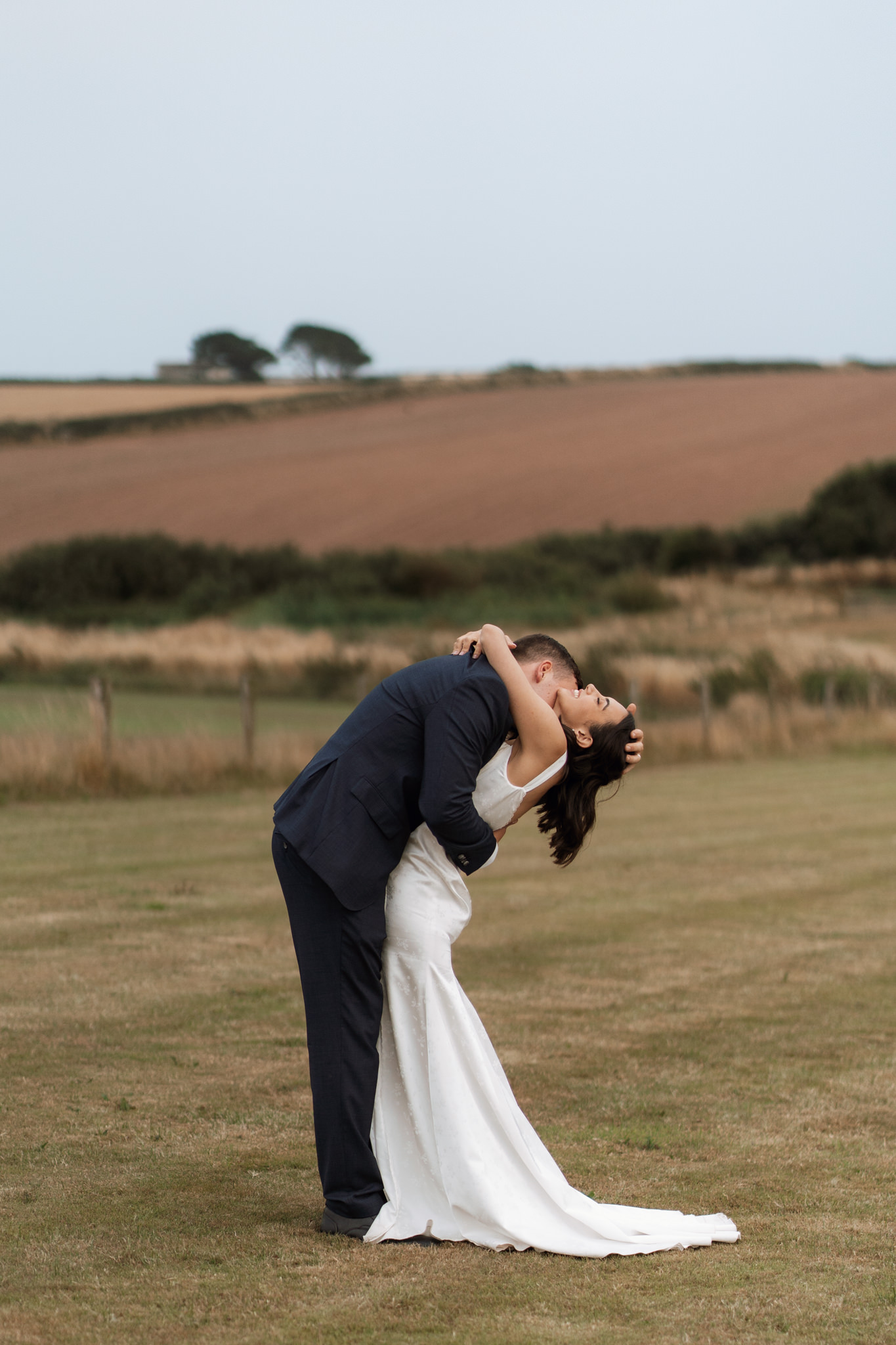 bride and groom embracing in celebration of their marriage